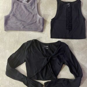 Garage- 3  crop tops, two black & one grey seamless top.  Small. Excellent Cond